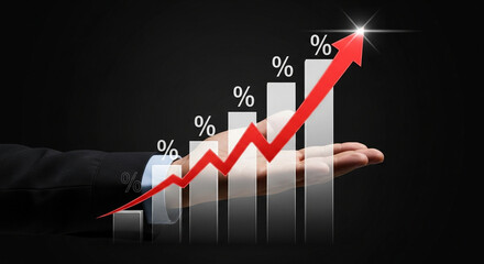 A businessman's hand supports a vibrant glowing red arrow showing continuous financial growth.
