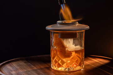 Aromatic smoke added to the top of an Old Fashioned Cocktail