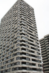 high rise apartment building, the facade of the new building