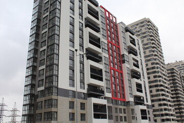 high rise apartment building, the facade of the new building
