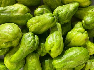 View from above of fresh small pumpkins in the market