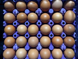 View from above of eggs in the egg tray in the market