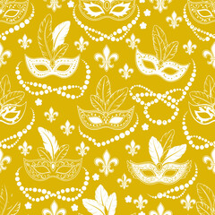 Mardi Gras carnival masks and fleur de lis seamless pattern on yellow background © DJ Art