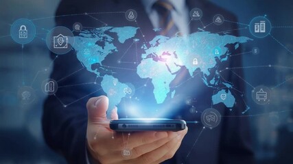 Businessman holding smartphone displaying global network with digital icons for security and commerce - Powered by Adobe