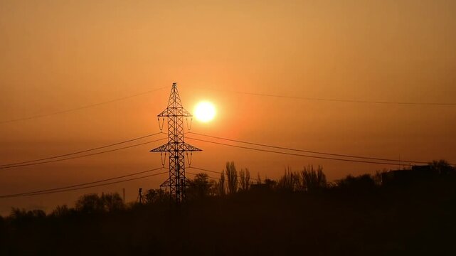 Sunrise over the city in the early morning time lapse. Winter fogy landscape