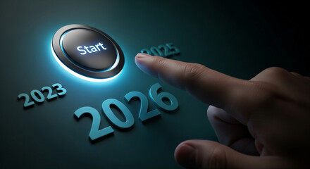 Finger about to press a glowing start button with the inscription Start with the numbers 2023, 2025 and 2026. Representative of new year, beginning