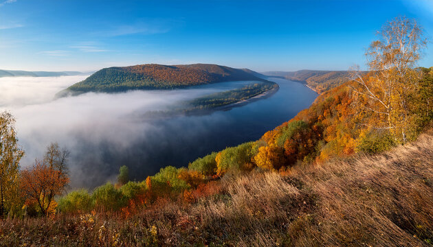 Volga River Against The Backdrop Of The Zhiguli Mountains Covered In Fog On An Autumn Morning