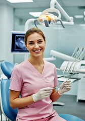 Young smiling Caucasian female dentist in a dental office