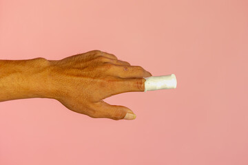 First aid and injuries concept, A man showing his Index finger covered with bandage or plaster on the lesion, An accident wound marks or injured on male hand, Healthcare and medical background.