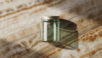 Clear Glass Jar with Gold Lid on a Marble Surface with Sunlight Shadows container