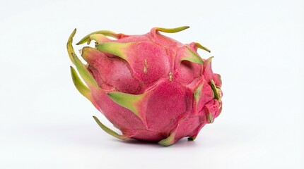 A whole dragon fruit pink skin isolated on a white background