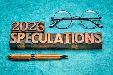 2026 year speculations concept - text in vintage letterpress wood type printing blocks with reading glasses, expectations and predictions for the New Year
