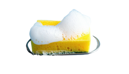 Foamy yellow sponge on a metal rack, isolated on a black background
