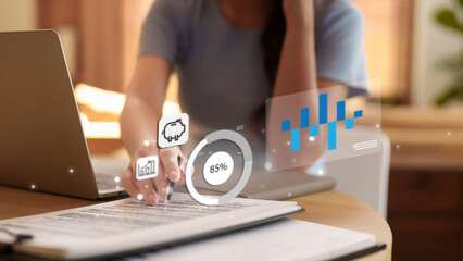 Asian adult hand analyzing financial data business planning investment strategy digital overlay laptop document productivity home office modern tech future finance wealth management