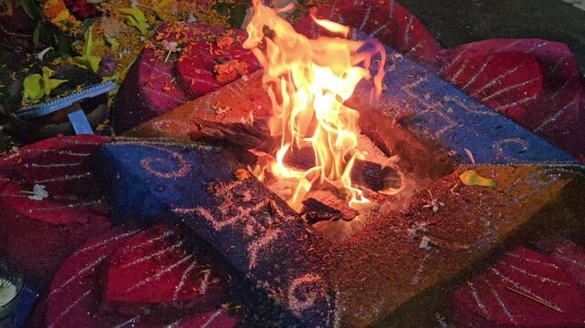 Deep spiritual devotion as a Hindu havan ceremony is performed, representing tradition, ritual worship, and cultural continuity.