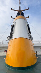 Ferry boat funnel on deck under blue sky