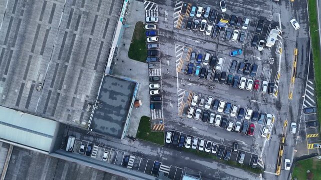 Aerial view showcasing a commercial retail park with store buildings, large parking lot in Vescovato Cremona Lombardy Italy