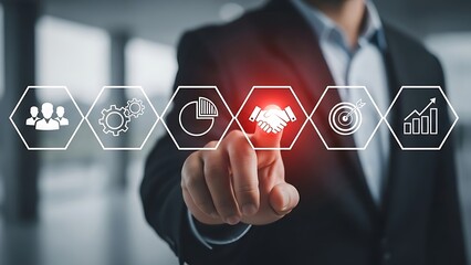 Businessman interacting with virtual interface icons for growth and strategy on blurred background