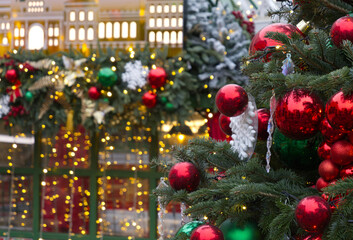New Year's Eve decoration of street. Christmas trees with balls on branches.