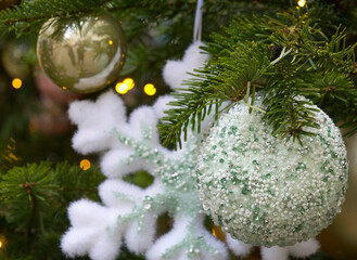 New Year's Eve decoration of street. Christmas trees with balls on branches.