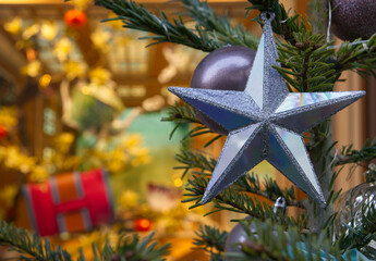 New Year's Eve decoration of street. Christmas trees with balls on branches.