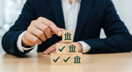 Businessman adjusting financial blocks