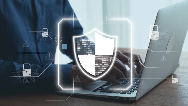 A professional illustrating digital security with a shield icon overlay on a laptop, emphasizing the importance of protecting information and data from online threats. Qubit