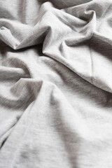 Dramatic lighting on denim fabric. Background, wallpaper.