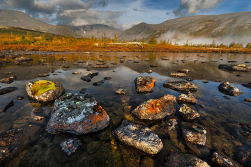 Misty Mountain Lake Landscape With Mossy Rocks, Autumn Colors, And Reflections © Aleksei Zakharov