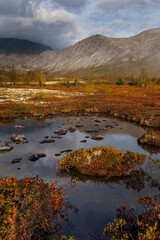 Autumn Mountain Landscape With Lake, Colorful Foliage, Rocks, and Misty Sky Above