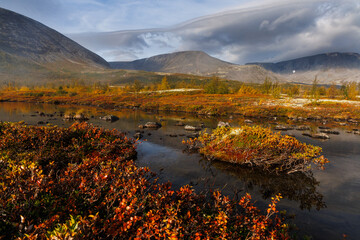 Autumn Mountain Landscape With Lake, Colorful Foliage, Rocks, and Misty Sky Above