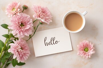 Pink flowers arranged beside a white card with handwritten greeting, accompanied by a cup of coffee, creating a warm and inviting flatlay scene with soft pastel tones