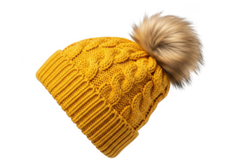 Yellow knitted beanie with a large fluffy pompom, isolated on transparent background