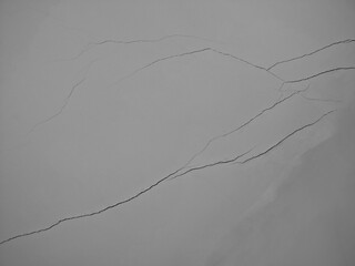 Diagonal cracks on the wall texture background