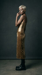 High Fashion Photo Shoot High Fashion Portrait of a Woman with Blonde Pixie Cut Wearing a Metallic Gold Corset and Velvet Skirt