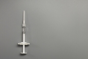 syringe on a gray background copy space