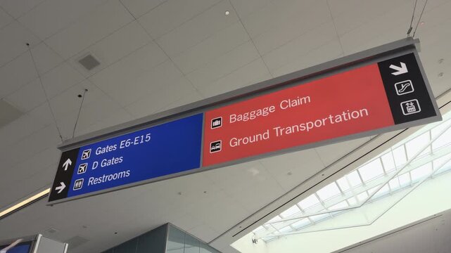 Direction signs at airport towards baggage claim