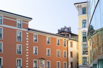 Fototapeta premium Colorful European Street With Orange Building Facade And Modern Glass Reflection