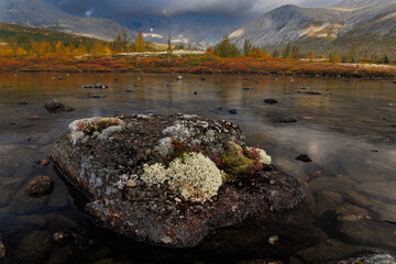 Autumn Mountain Lake Landscape With Reflections, Large Rocks, and Calm Water in Remote Valley