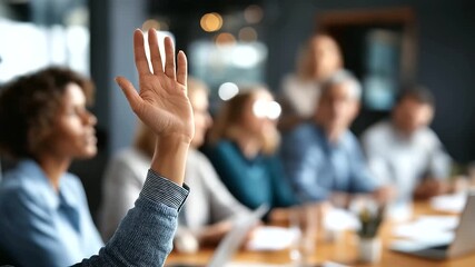 Diverse business team in meeting room with hand raised for question faceless participants defocused conference background strategic planning session collaborative environment