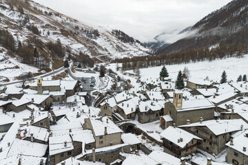 Aerial view of Chianale during winter season, a typical alpine village in Piedmont region, Italy