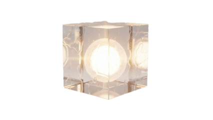 A brightly lit, transparent glass cube contains a glowing spherical light source at its core.