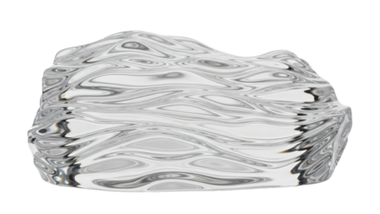 A rough, irregular block of clear, transparent material exhibits a surface with fluid, wave-like patterns.