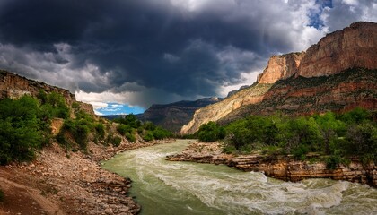 Turbulent River Rages Through A Majestic Canyon Under Stormy Skies
