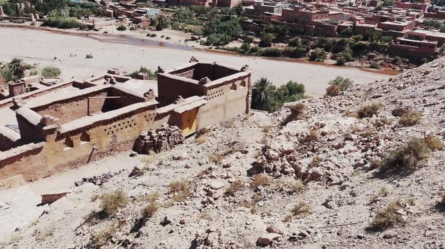 Traditional panoramic view of architecture in Ait Benhaddou situated near a dry riverbed in Morroco