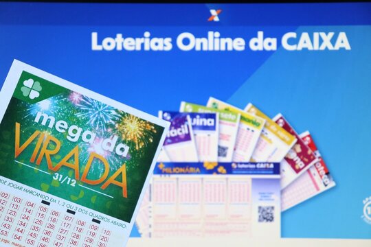 Salvador, Brazil - December 24, 2025: Mega da Virada lottery tickets. Brazilian New Year's Eve 1 Billion Reais jackpot betting slips. Loterias Caixa Mega da Virada. Mega Sena. 