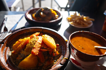Traditional Moroccan tagine with vegetables served in a clay pot