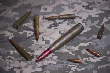 gun ammo on camouflage background