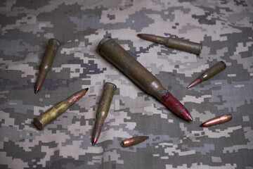 gun ammo on camouflage background