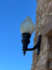 A light fixture on a building facade